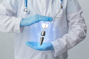 dentist with a hologram of a dental implant in their hands