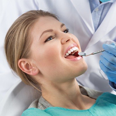 Woman receiving dental exam