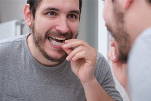 man putting in mouthguard