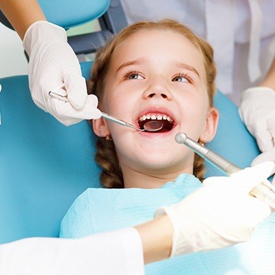 Child receiving dental checkup