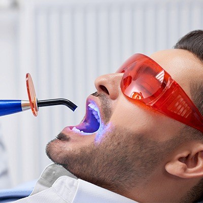 Man receiving dental bonding treatment