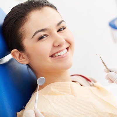 Smiling woman in dental chair