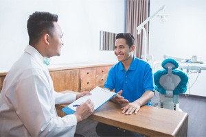 dentist explaining treatment to patient