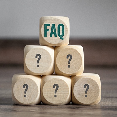 Wooden blocks with FAQ and question marks