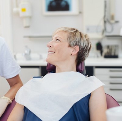 Middle-aged patient speaking to dentist