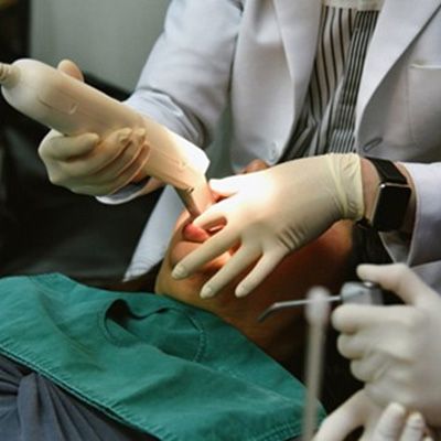 dentist using iTero scanner with patient 