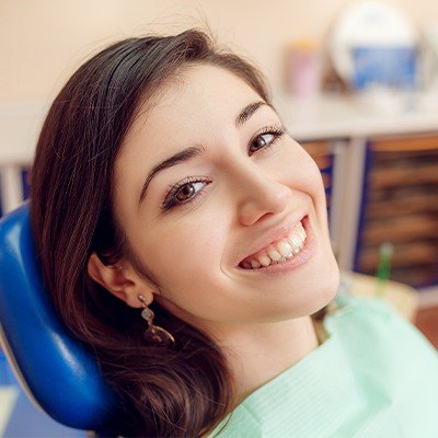 Smiling woman in dental chair