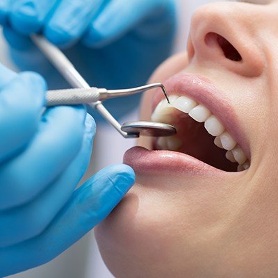 Woman receiving gum disease treatment