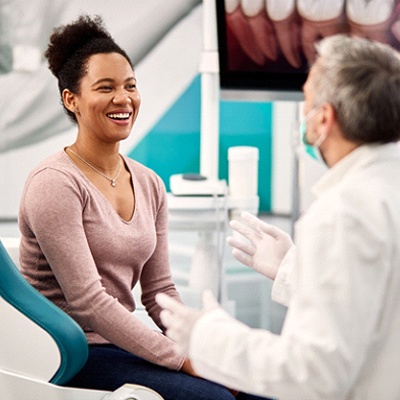 patient smiling at dentist during appointment