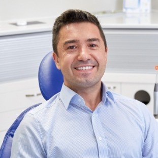 Smiling man in dental chair