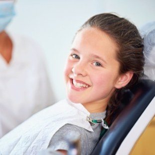 Smiling child in dental chair