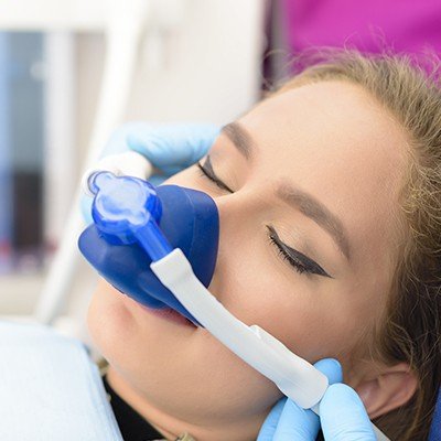 Woman with nitrous oxide nasal mask