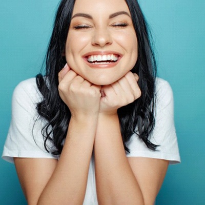 young woman smiling proudly