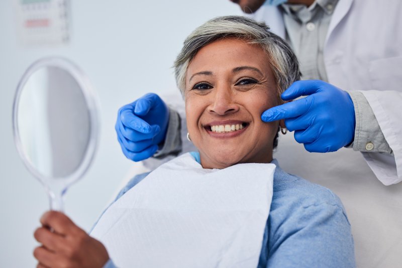 A woman receiving a dental checkup from her dentist