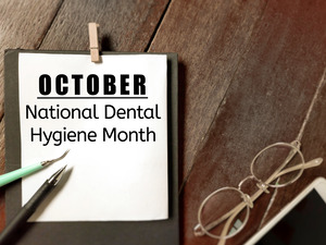 Calendar that says “October National Dental Hygiene Month”